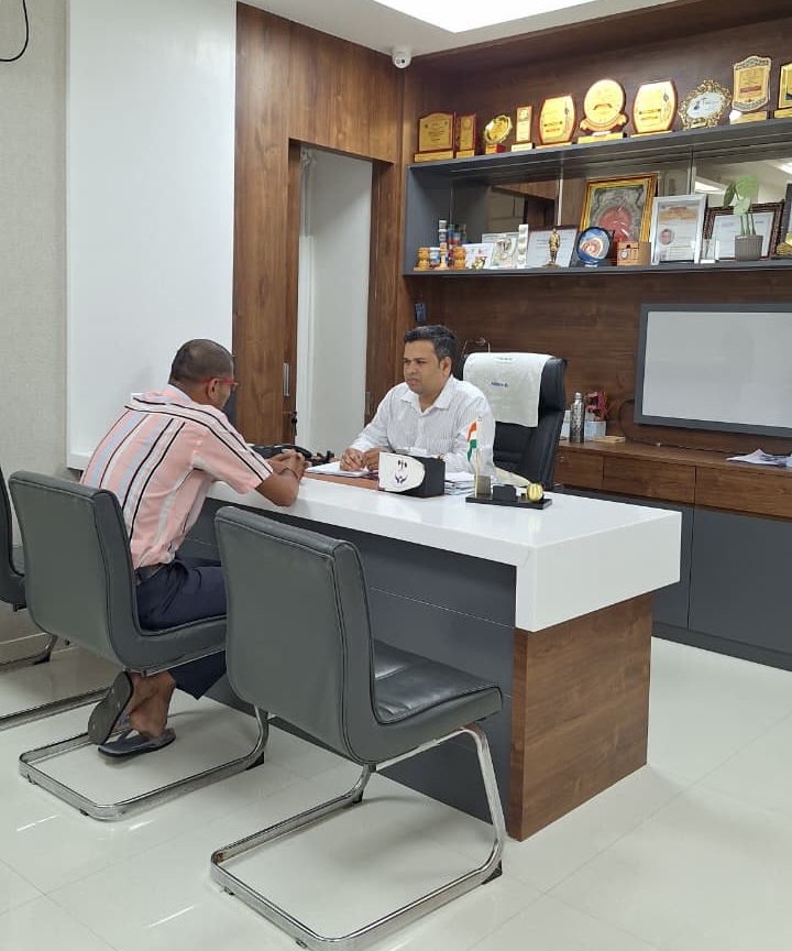 Doctor consulting patient in clinic office